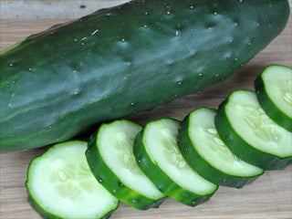 Sliced Poinsett 76 cucumber showing its dark green skin and crisp interior
